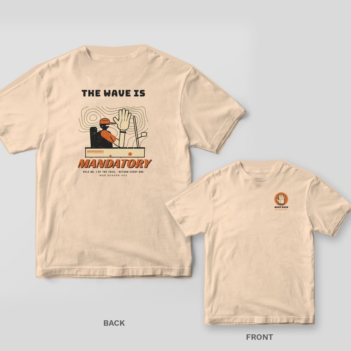 Ivory Comfort Colors 1717 tee shown back and front: driver waving out of a doorless rig over topo lines with The Wave Is Mandatory text on the back, waving hand badge reading Wave Back on the left chest