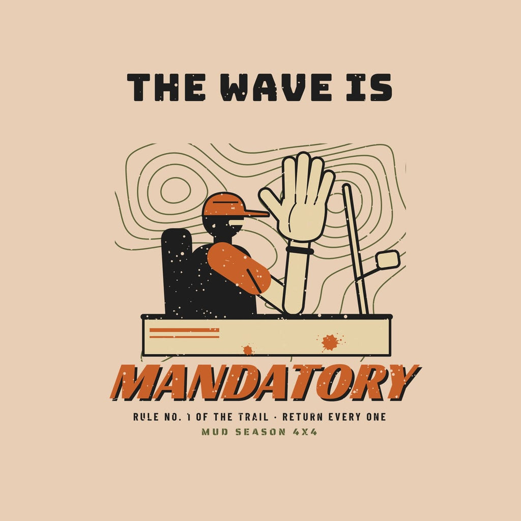 Close-up of the back print artwork, driver waving out of a doorless rig over topo lines with The Wave Is Mandatory text, on an ivory background