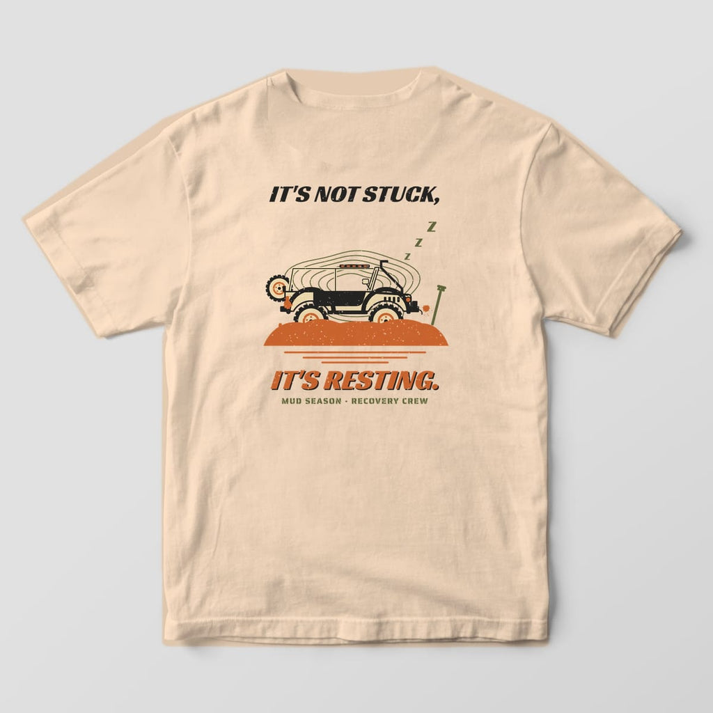 Back of an Ivory Comfort Colors 1717 tee printed with a trail rig sunk in orange mud with sleeping Z's and It's Not Stuck, It's Resting text