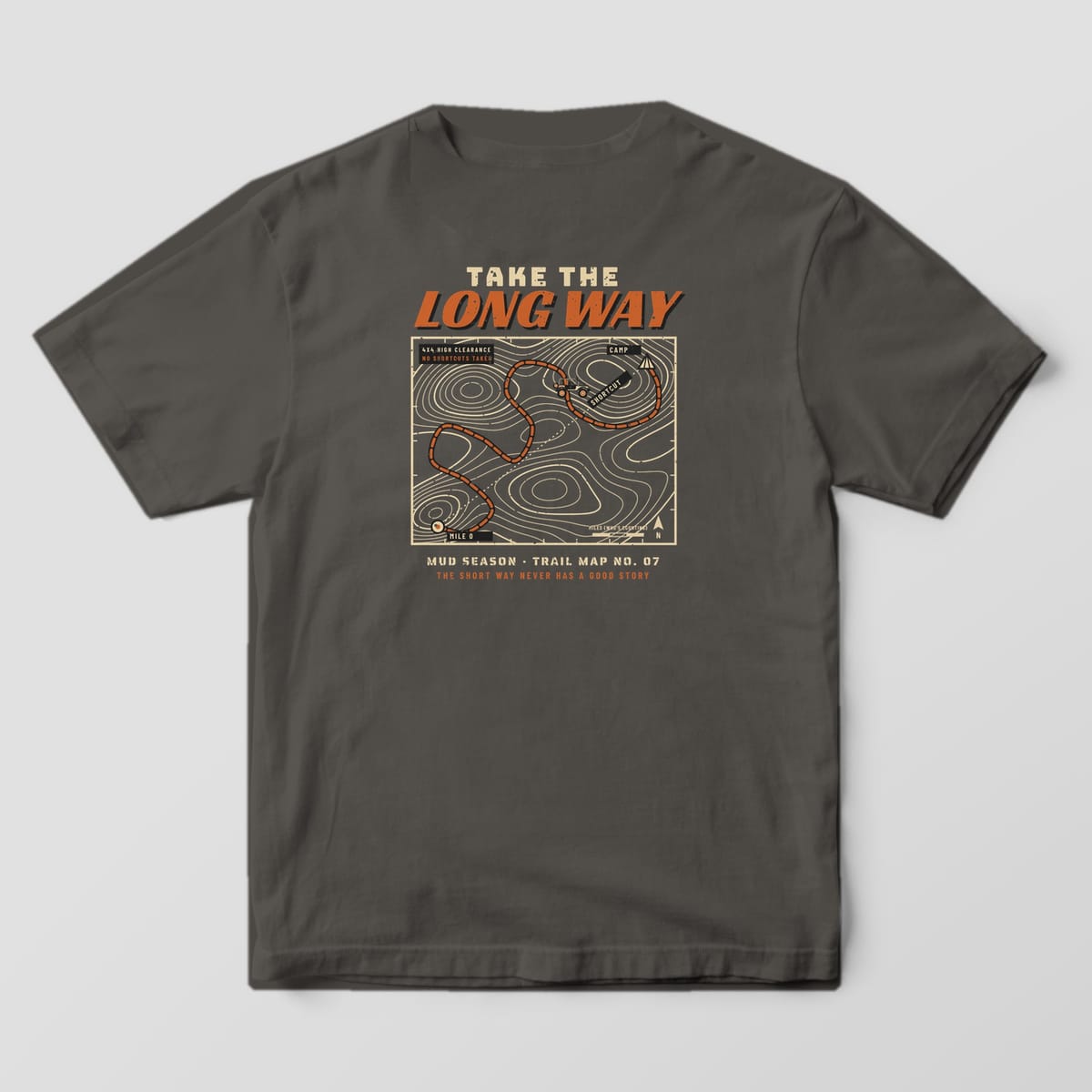 Back of a Pepper Comfort Colors 1717 tee printed with a topographic trail map with a winding route from Mile 0 to Camp and Take the Long Way headline
