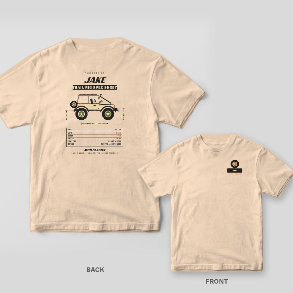 Ivory Comfort Colors 1717 tee shown back and front: custom name trail rig spec sheet with a lifted 4x4 side view and spec table on the back, tire icon over a custom nameplate on the left chest