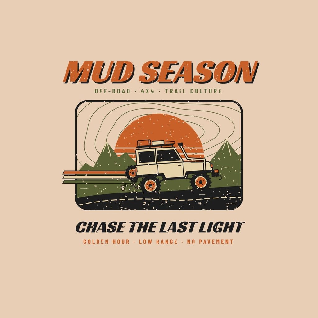 Close-up of the full-front artwork: a lifted 4x4 with speed stripes climbing past mountains and a striped sun, shown flat on an ivory background.