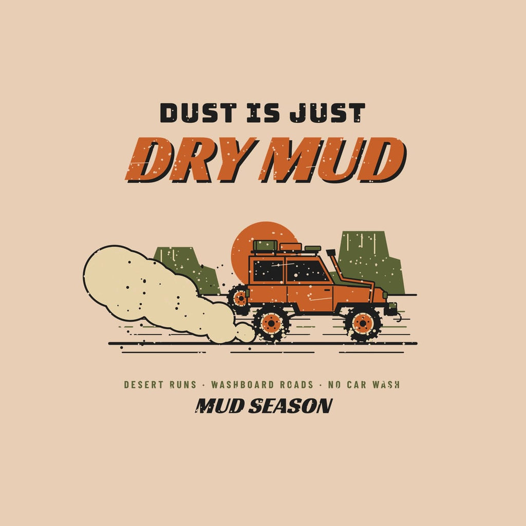 Close-up of the full back artwork: a 4x4 on a washboard desert road with a dust plume, buttes and sun, shown flat on an ivory background.