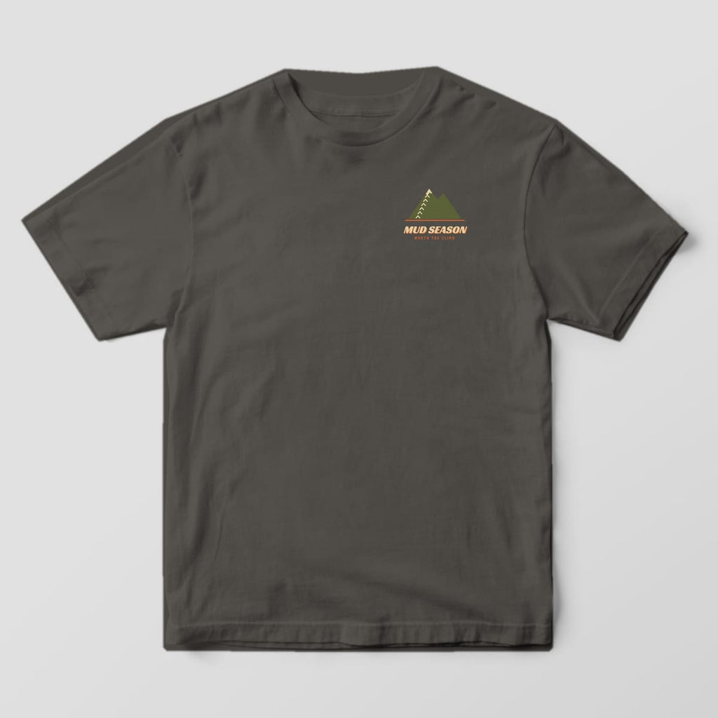Front of a pepper Comfort Colors 1717 T-shirt with a small mountain and Mud Season left-chest print.
