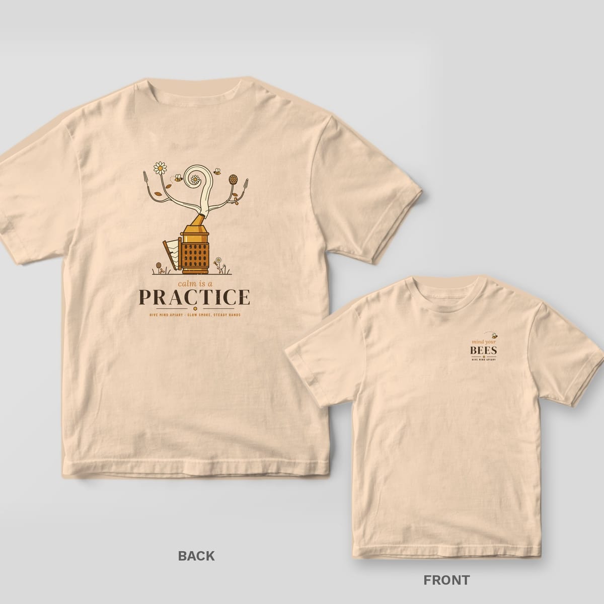 Back and front of a ivory Comfort Colors T-shirt; the back shows a vintage bee smoker whose smoke curls into wildflowers above the words calm is a practice, the front has a small left-chest print.
