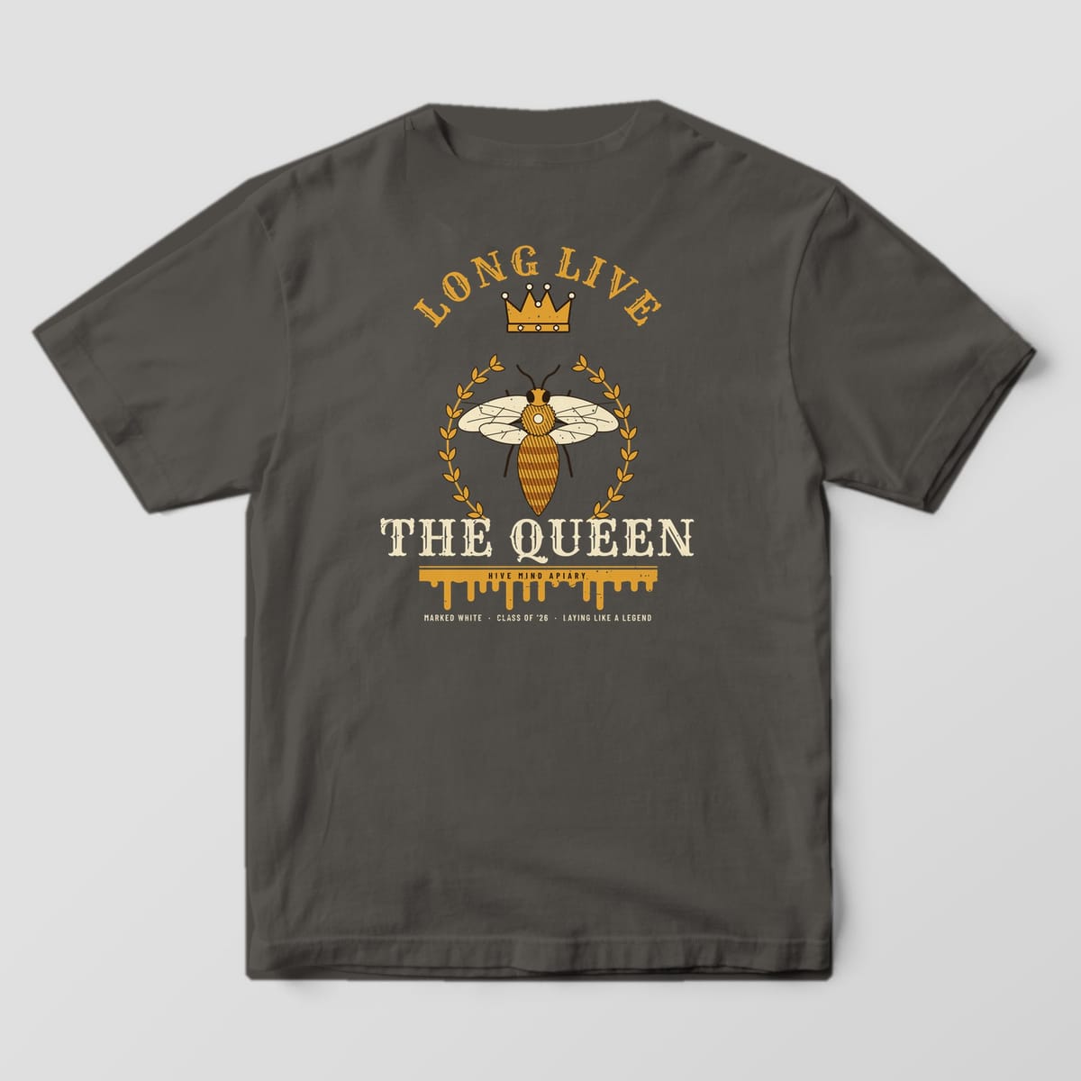 Back of a pepper Comfort Colors 1717 T-shirt printed with a crowned queen bee in a laurel wreath with long live the queen lettering.