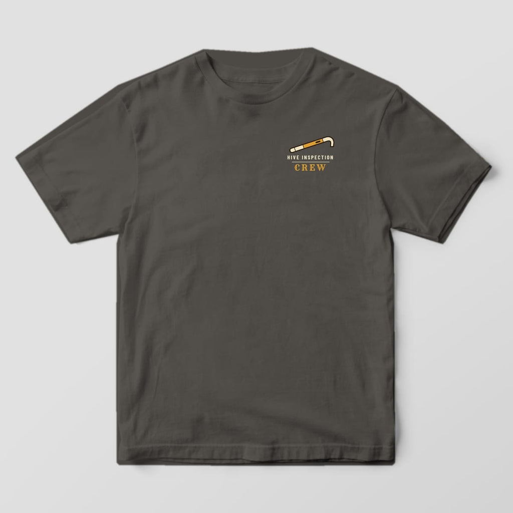 Front of a pepper Comfort Colors 1717 T-shirt with a small Hive Mind Apiary left-chest print.