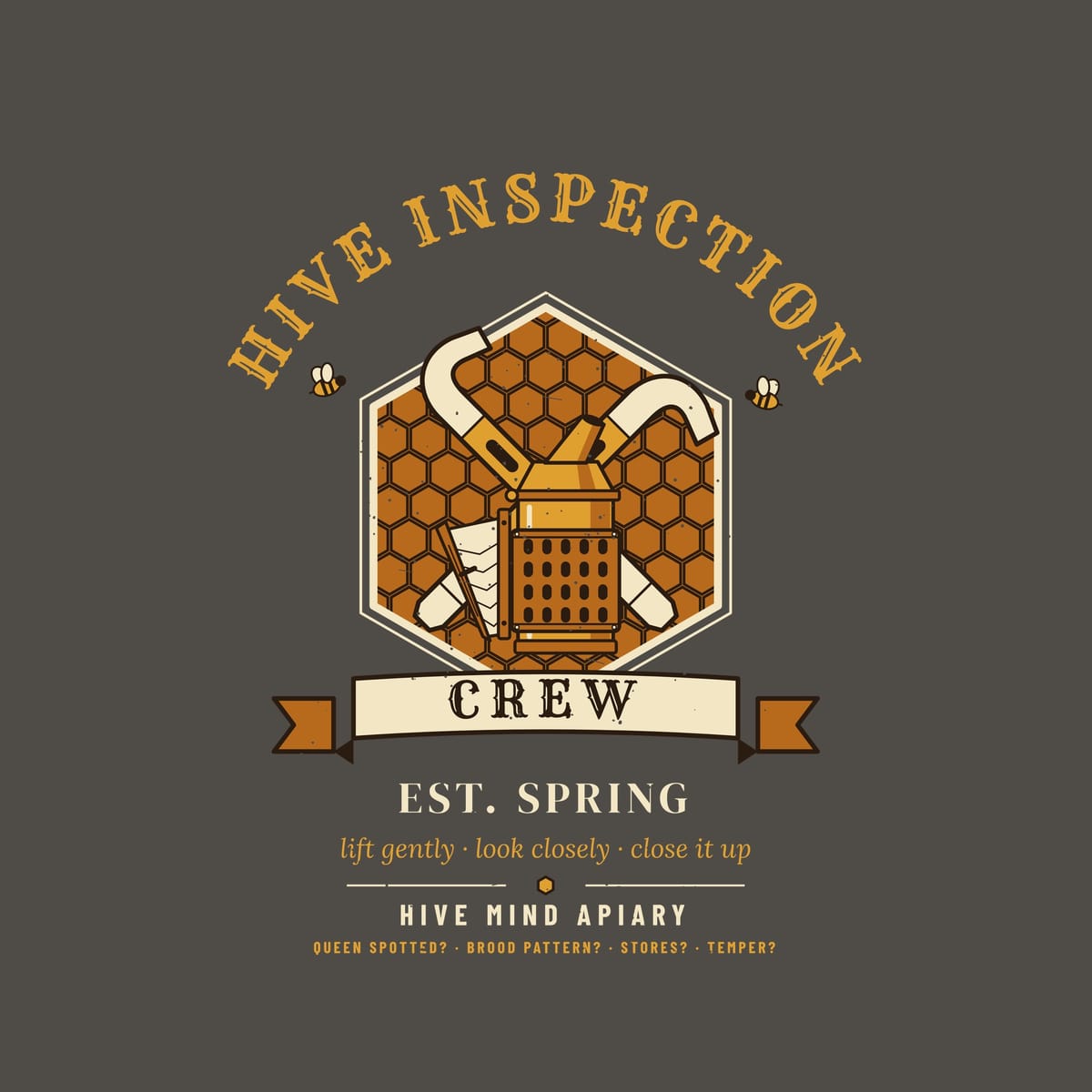 Close-up of the full back artwork: a crest of crossed hive tools and a bee smoker on a honeycomb hexagon titled Hive Inspection Crew, shown flat on a pepper background.
