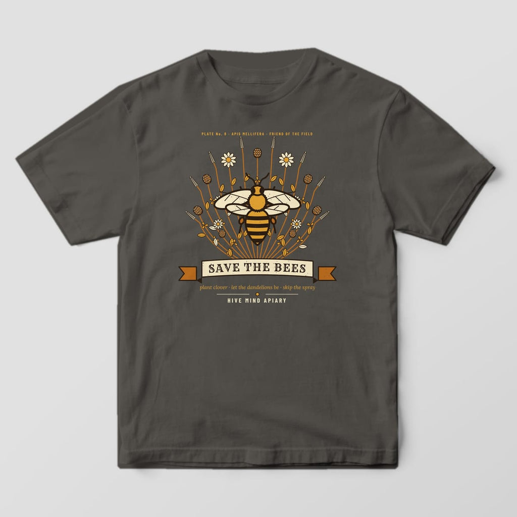 Front of a pepper Comfort Colors 1717 T-shirt printed with a large honey bee over clover and lavender with a Save The Bees ribbon.