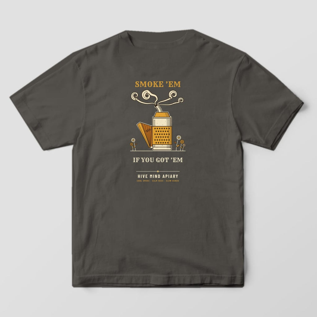 Back of a pepper Comfort Colors 1717 T-shirt printed with an engraved bee smoker with curling smoke and the words Smoke 'Em If You Got 'Em.
