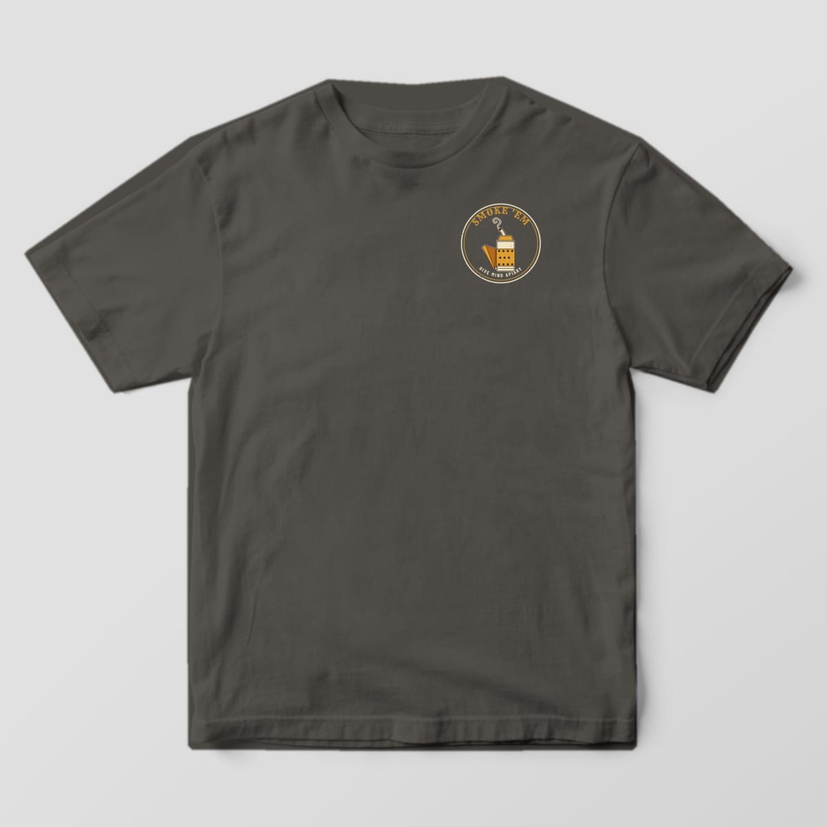 Front of a pepper Comfort Colors 1717 T-shirt with a small round bee smoker badge on the left chest.