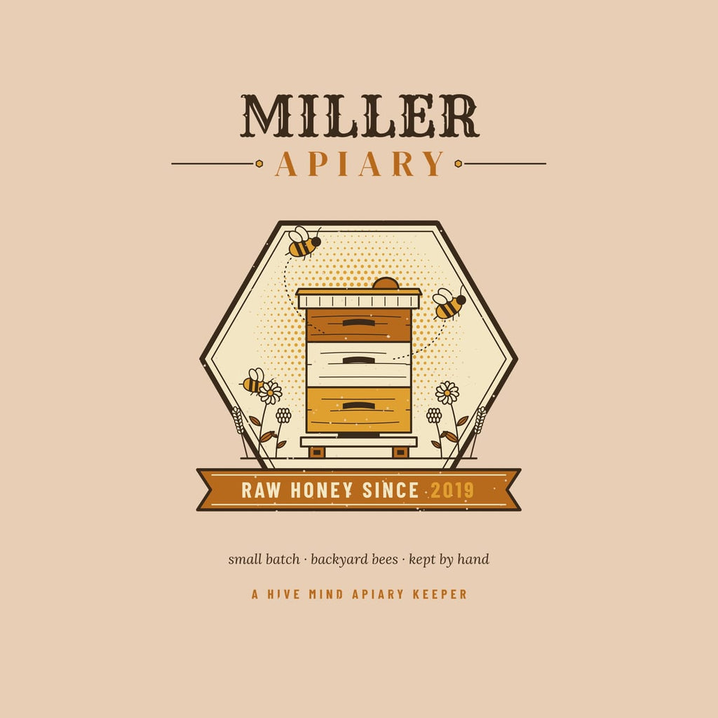 Close-up of the full back artwork: a personalized hexagon emblem with the name Miller Apiary, a painted beehive and a Raw Honey Since 2019 banner, shown flat on an ivory background.