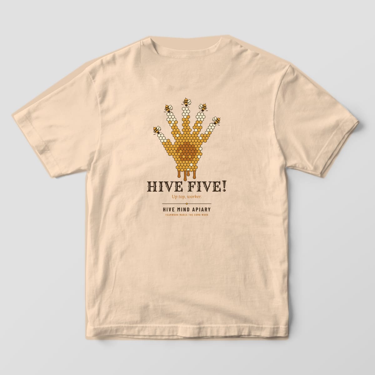 Back of an ivory Comfort Colors 1717 T-shirt printed with a hand made of honeycomb cells with a bee at each fingertip, titled Hive Five.