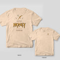 Back and front of an ivory Comfort Colors T-shirt; the back shows dripping gold lettering reading just here for the HONEY under a honey dipper and daisy, the front has a small honey bee left-chest print.