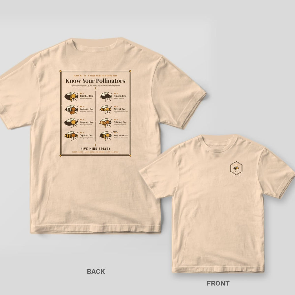 Back and front of an ivory Comfort Colors T-shirt; the back shows a framed field guide page titled Know Your Pollinators showing eight labeled native bees, the front has a small hexagon field guide badge with a bumble bee on the left chest.
