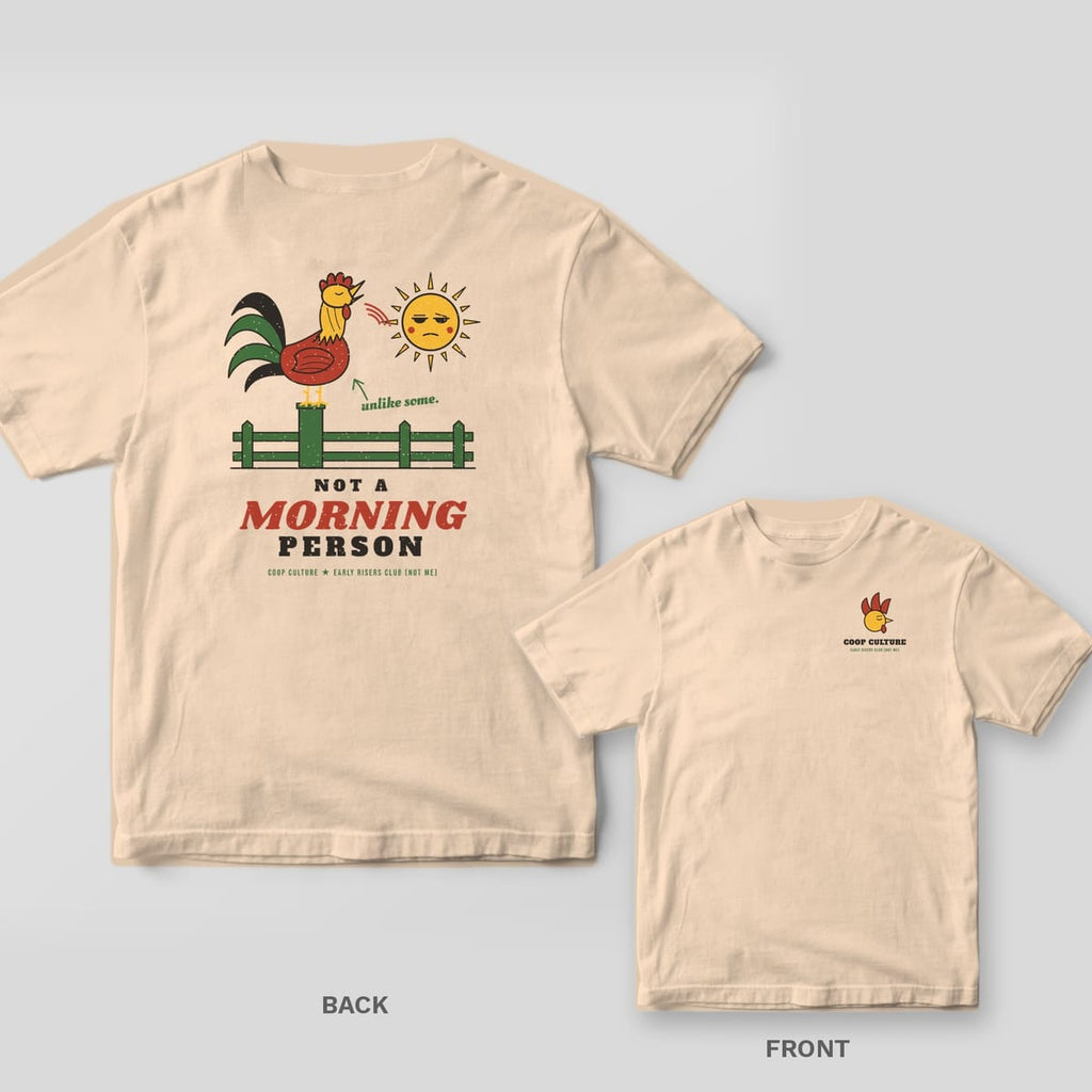 Ivory tee shown back and front: back has a rooster crowing at a grumpy sun over Not A Morning Person text; front has a small rooster head logo.