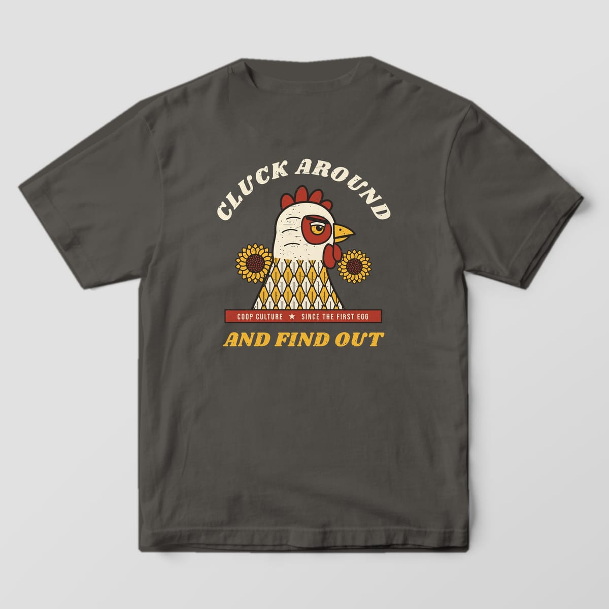 Back of a pepper Comfort Colors 1717 tee with the Cluck Around And Find Out hen portrait and sunflowers.