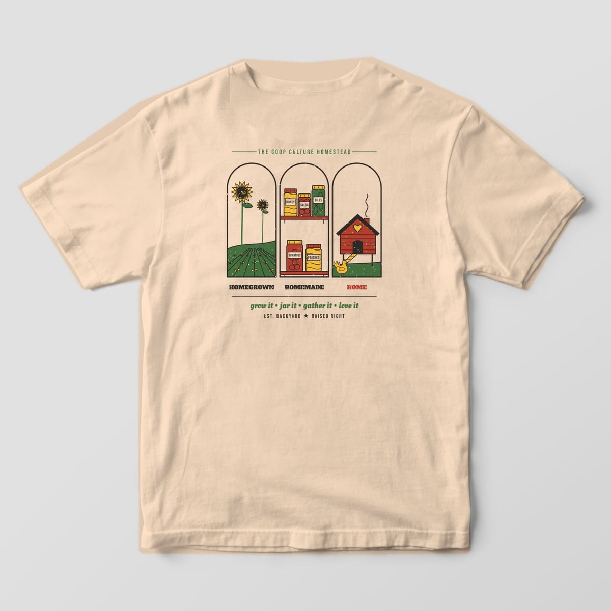 Back of an ivory Comfort Colors 1717 tee with three arches showing a garden, canning jars and a red chicken coop above the words Homegrown Homemade Home.
