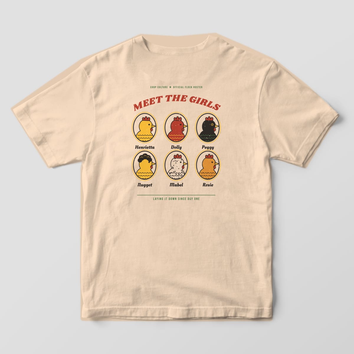 Back of an ivory Comfort Colors 1717 tee with six oval hen portraits named Henrietta, Dolly, Peggy, Nugget, Mabel and Rosie under the words Meet The Girls.
