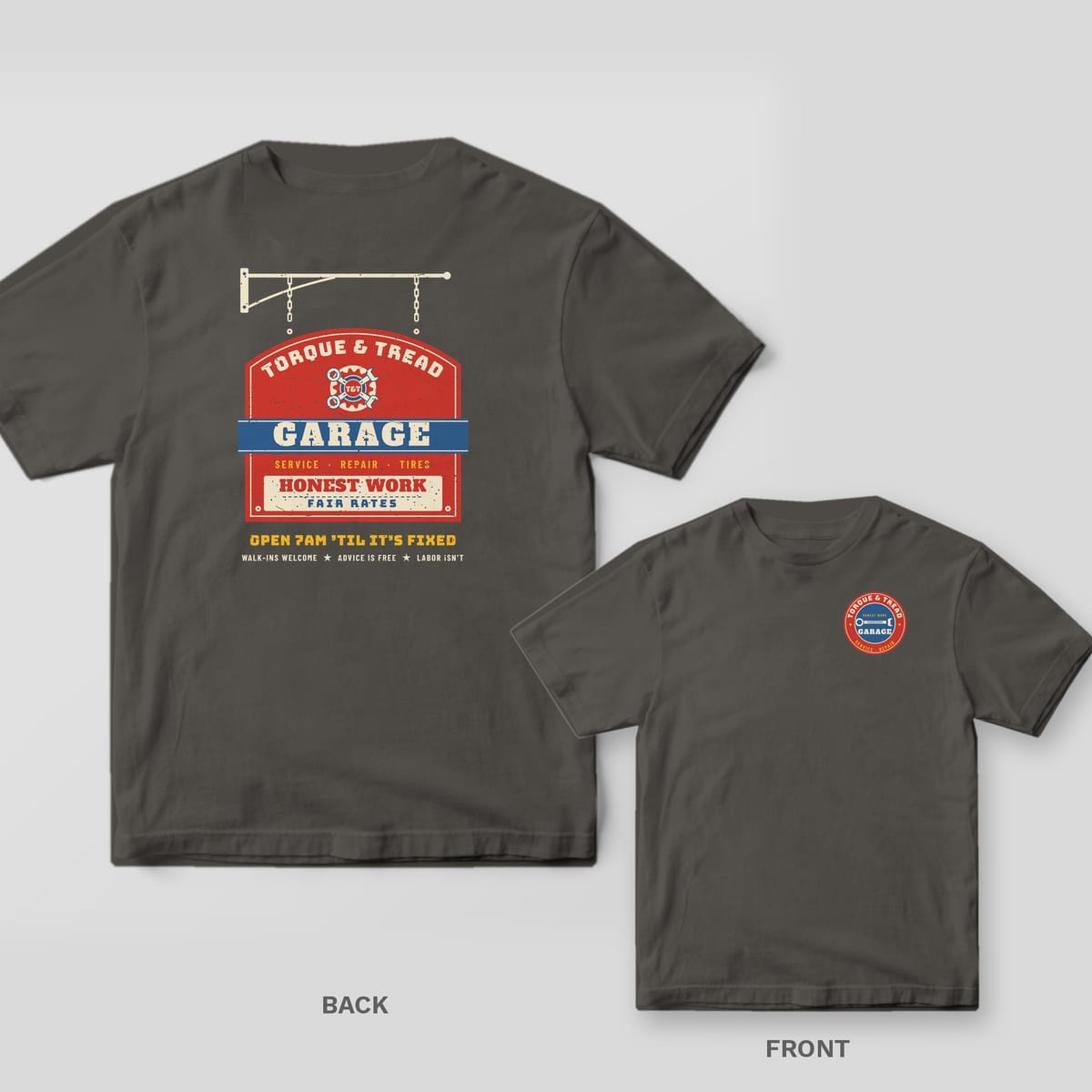 Pepper Comfort Colors tee shown back and front: a hanging vintage garage sign reading Honest Work, Fair Rates on the back and a small round service badge on the chest.