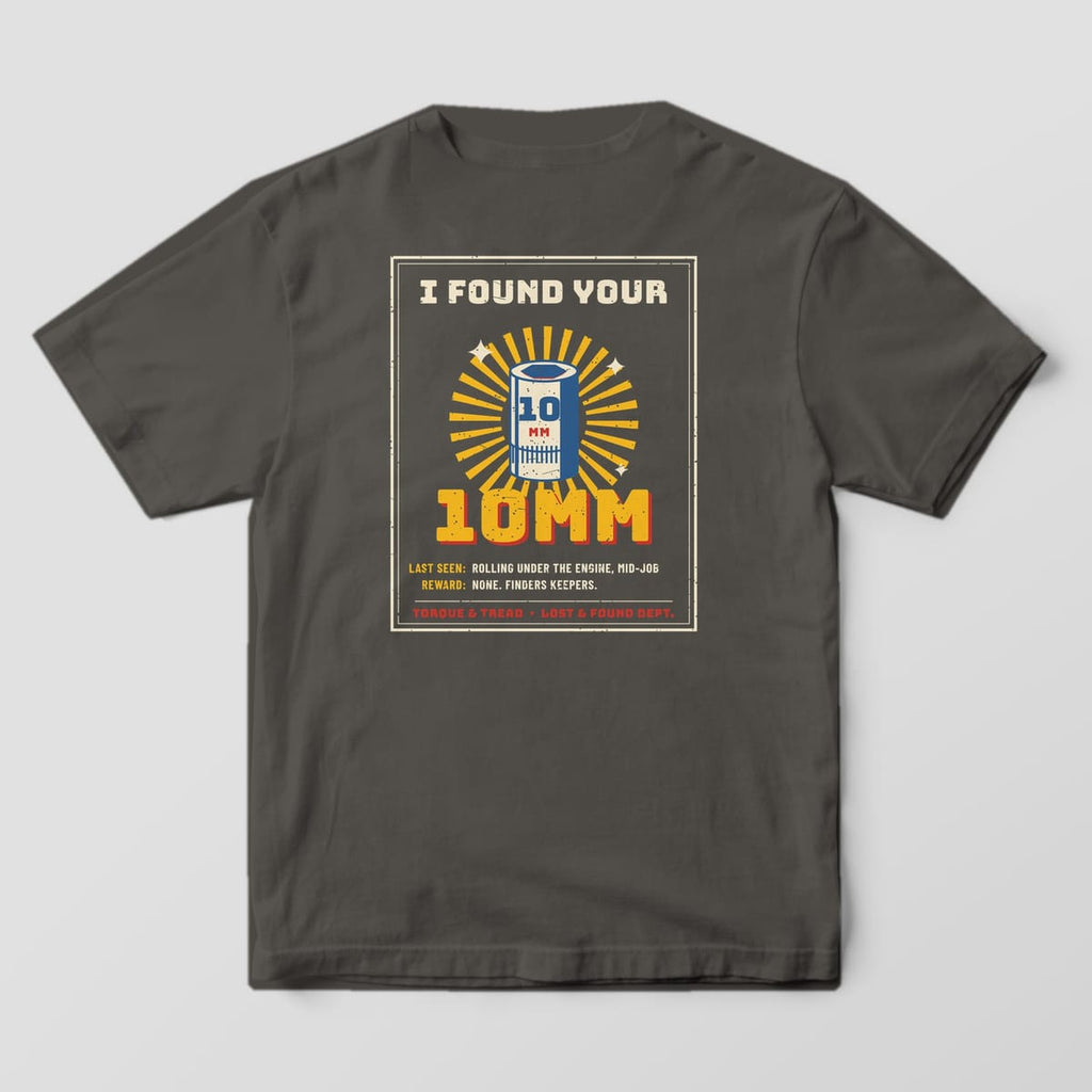 Back of a Pepper Comfort Colors 1717 tee with the cream-framed poster reading I Found Your 10mm with a blue and cream socket glowing in yellow rays.