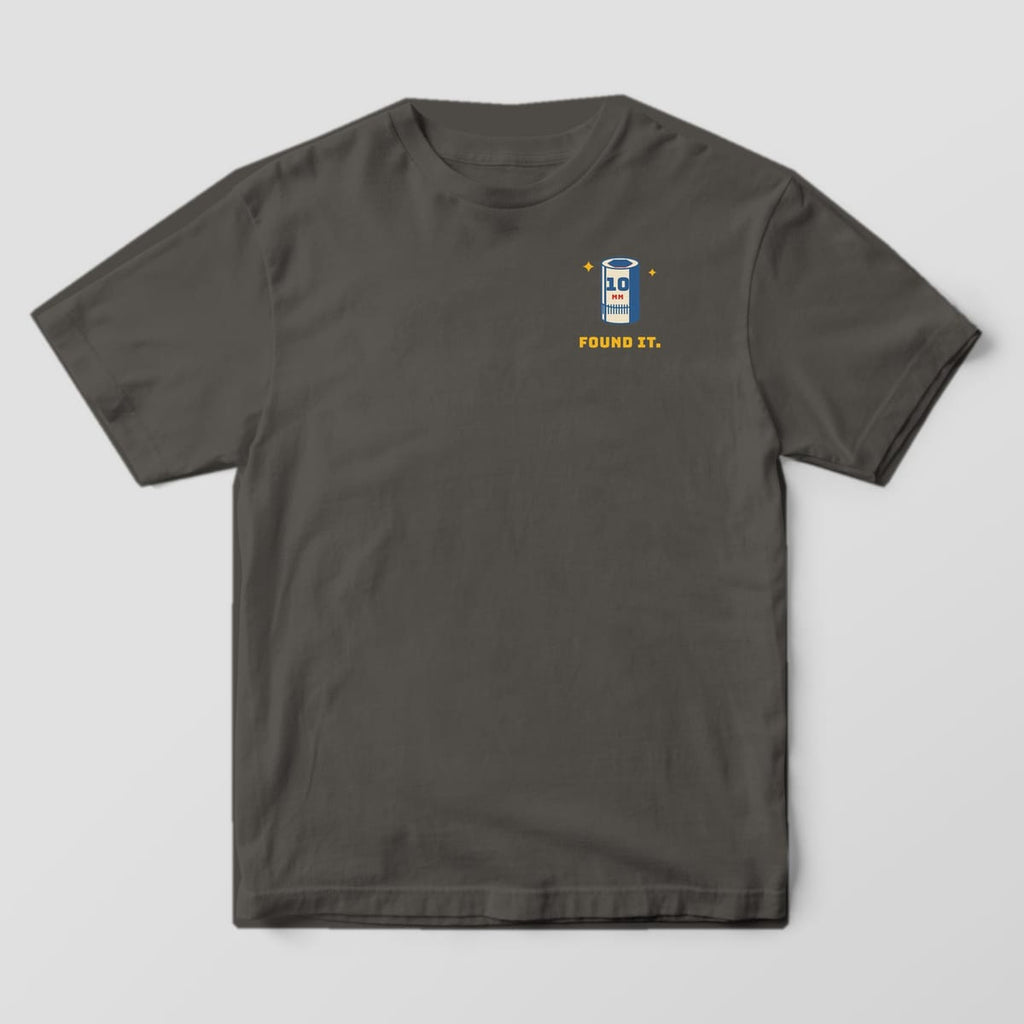 Front of a Pepper Comfort Colors 1717 tee with a small 10mm socket icon with sparkles above the words Found It on the left chest.