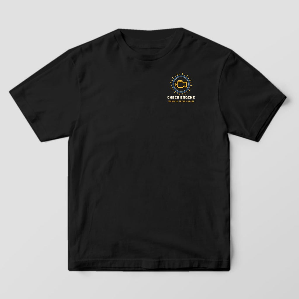 Front of a Black Comfort Colors 1717 tee with a small glowing check-engine lamp above the words Check Engine on the left chest.