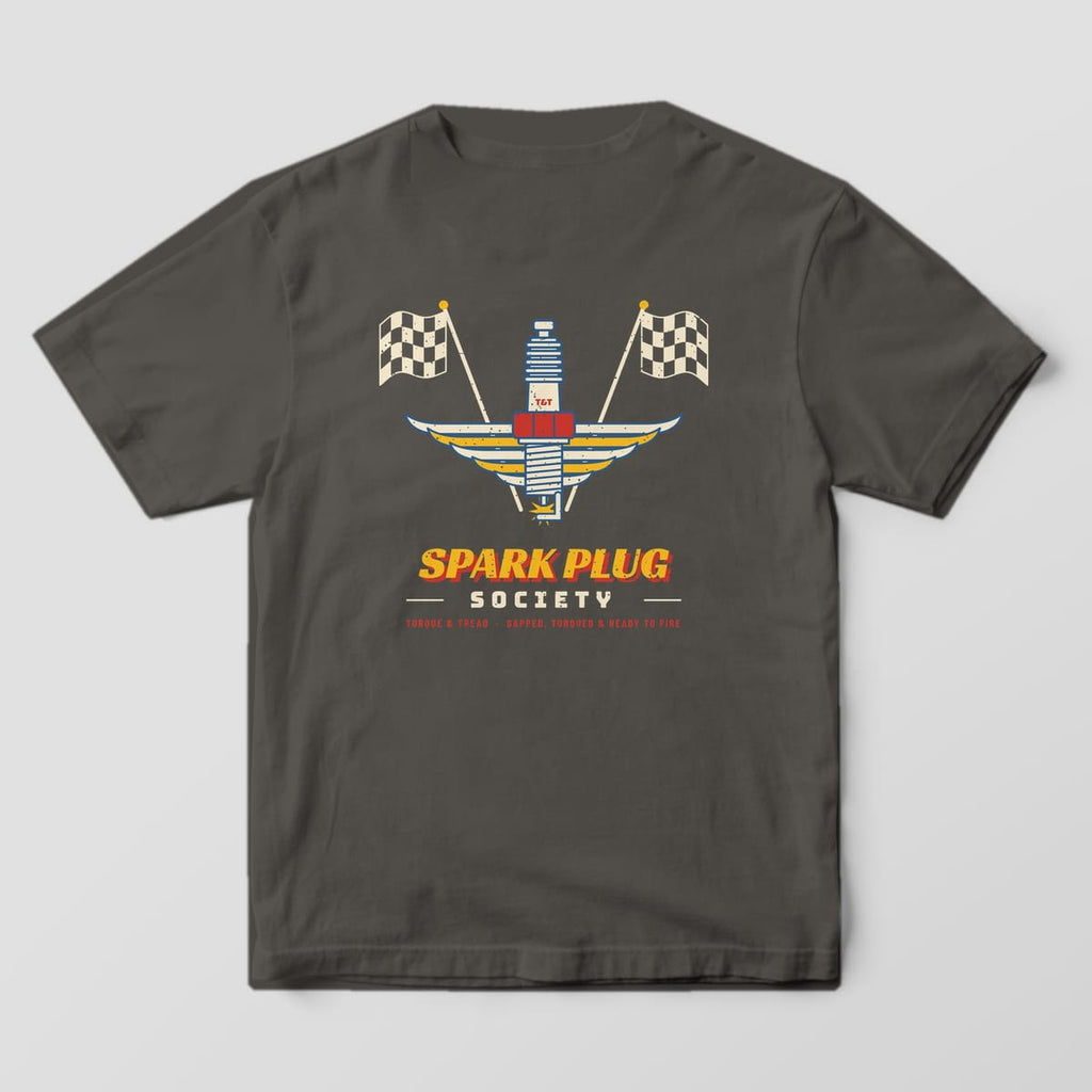Back of a Pepper Comfort Colors 1717 tee with the cream and blue spark plug with a red hex nut and layered cream and yellow wings, crossed checkered flags and the words Spark Plug Society.