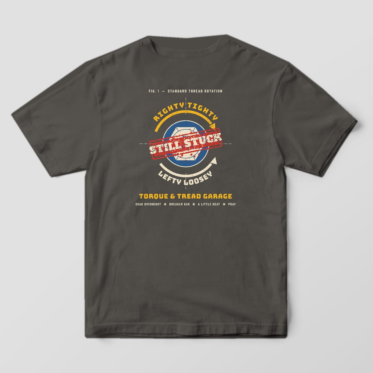 Back of a Pepper Comfort Colors 1717 tee with the shop-manual diagram of a rusty bolt head with Righty Tighty and Lefty Loosey arrows and a red Still Stuck stamp.