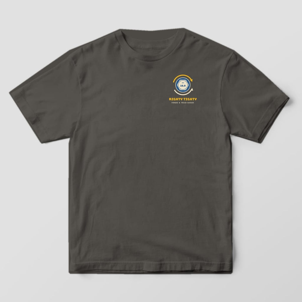 Front of a Pepper Comfort Colors 1717 tee with a small bolt head with rotation arrows and the words Righty Tighty on the left chest.
