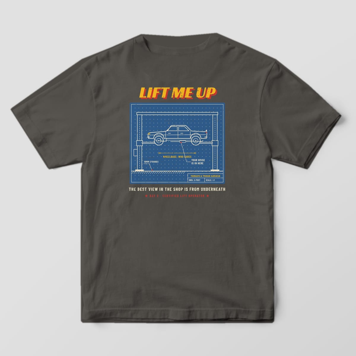 Back of a Pepper Comfort Colors 1717 tee with the blue blueprint drawing of a classic sedan raised on a two-post car lift with dimension lines and callouts under the words Lift Me Up.