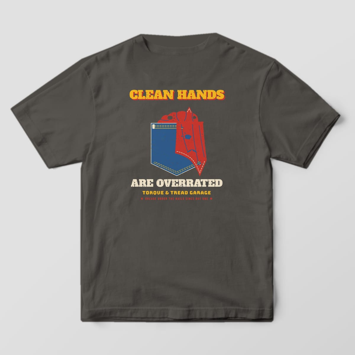 Back of a Pepper Comfort Colors 1717 tee with the denim back pocket with a red oil-stained shop rag hanging out between the words Clean Hands and Are Overrated.