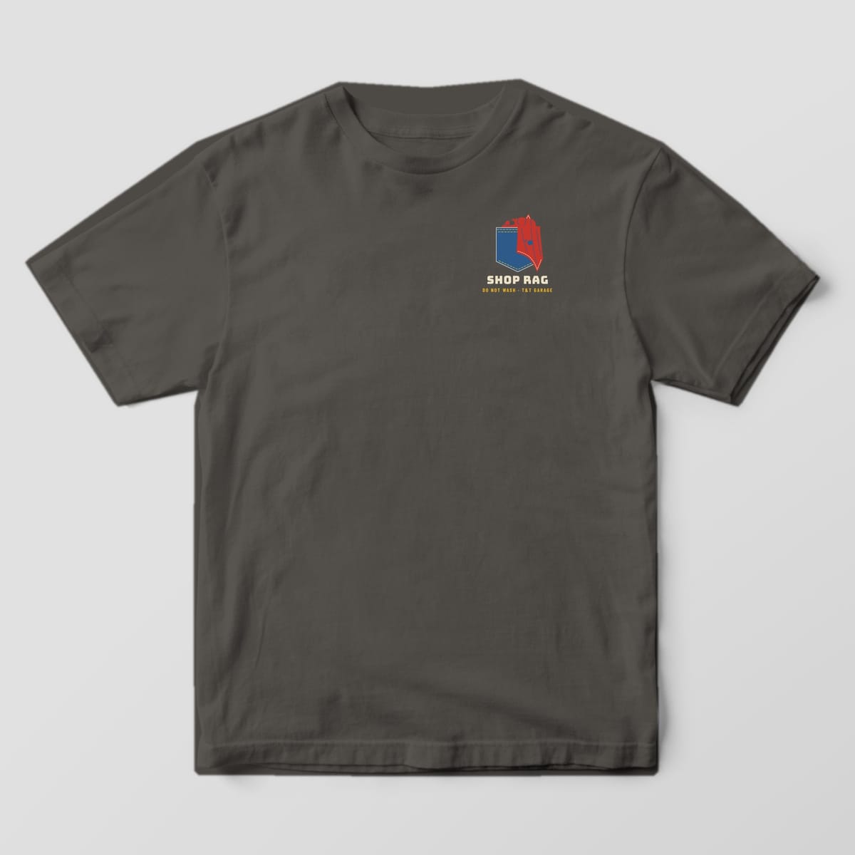 Front of a Pepper Comfort Colors 1717 tee with a small denim pocket with a red shop rag and the words Shop Rag on the left chest.