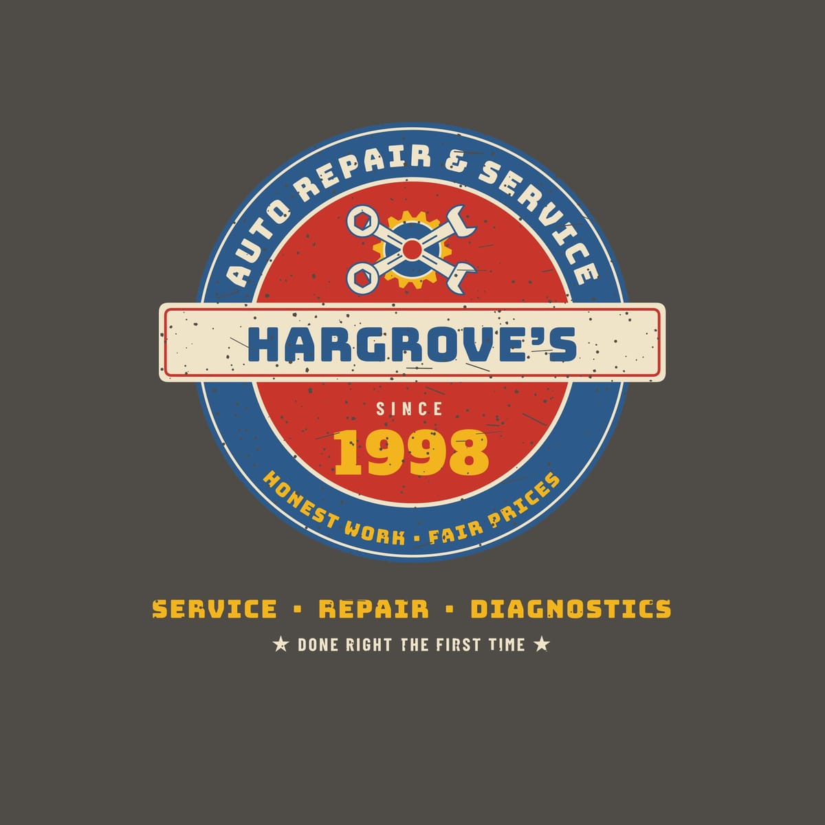 Close-up of the print: blue and red porcelain-style roundel with cream ring text, crossed wrenches over a yellow gear, a cream name bar with blue lettering and a yellow year, with light speckled distressing.