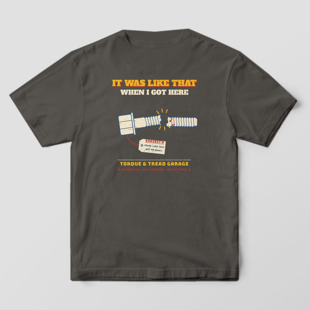 Back of a Pepper Comfort Colors 1717 tee with the snapped bolt in two pieces with an Exhibit A evidence tag under the words It Was Like That When I Got Here.