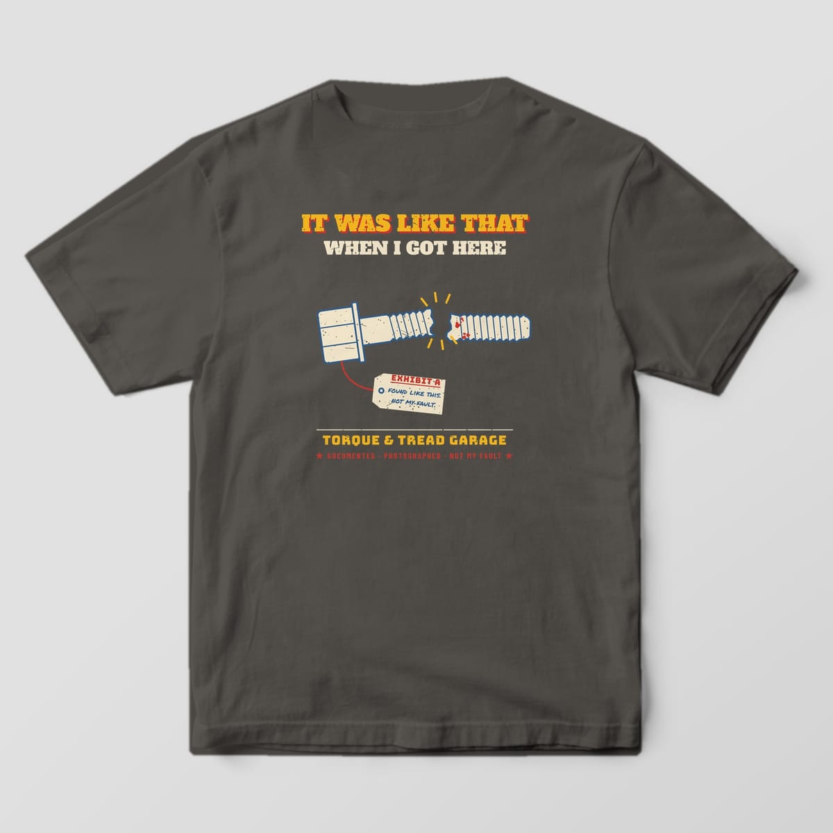 Back of a Pepper Comfort Colors 1717 tee with the snapped bolt in two pieces with an Exhibit A evidence tag under the words It Was Like That When I Got Here.
