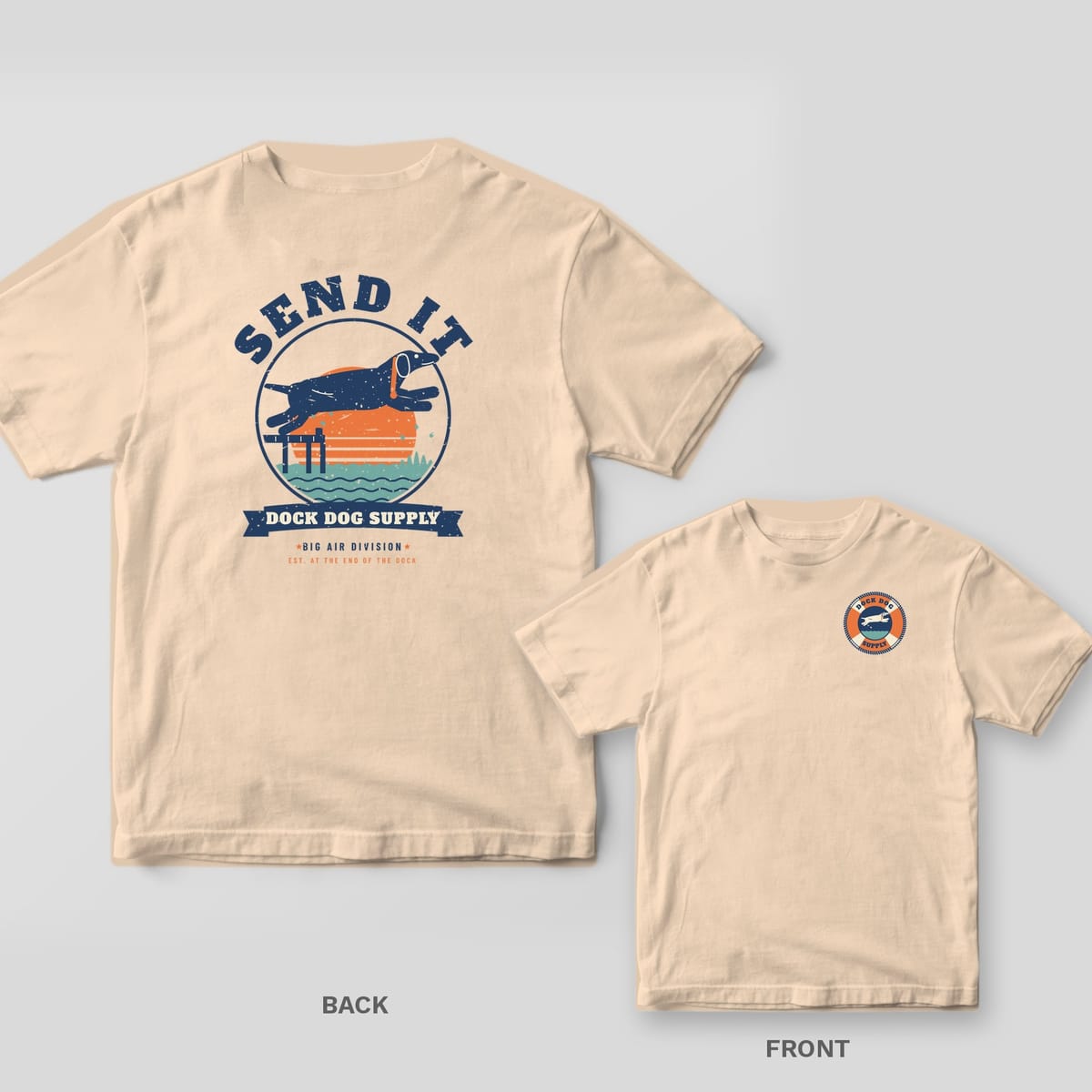 Ivory tee with a leaping lab over a retro sunset and Send It on the back, small life-ring dog badge on the front chest
