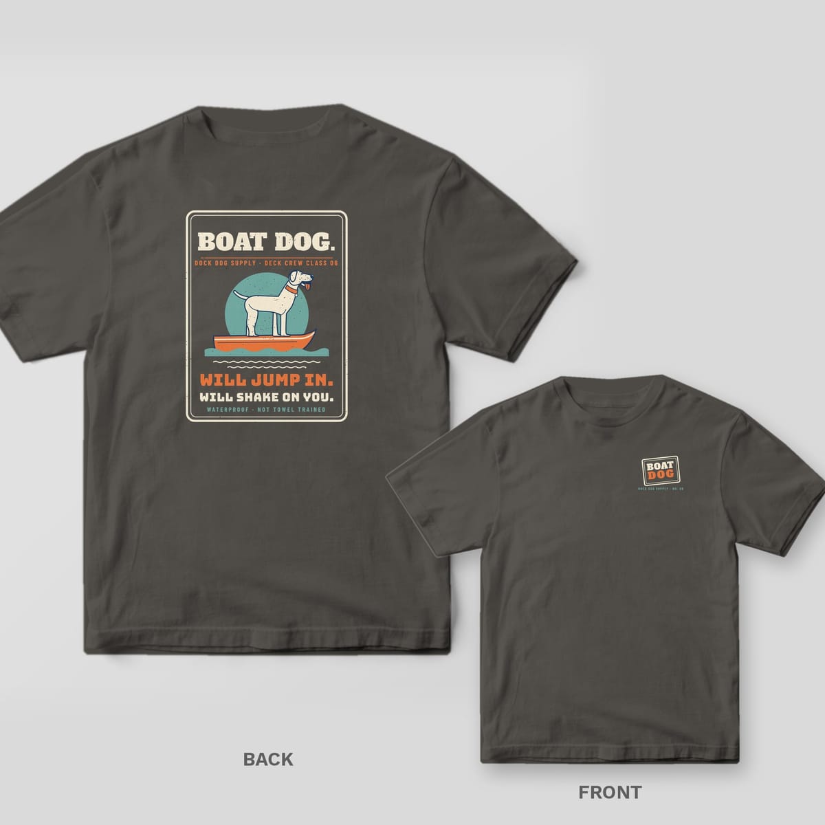 Charcoal tee with a Boat Dog placard on the back showing a lab on a skiff bow, small Boat Dog stamp on the front chest