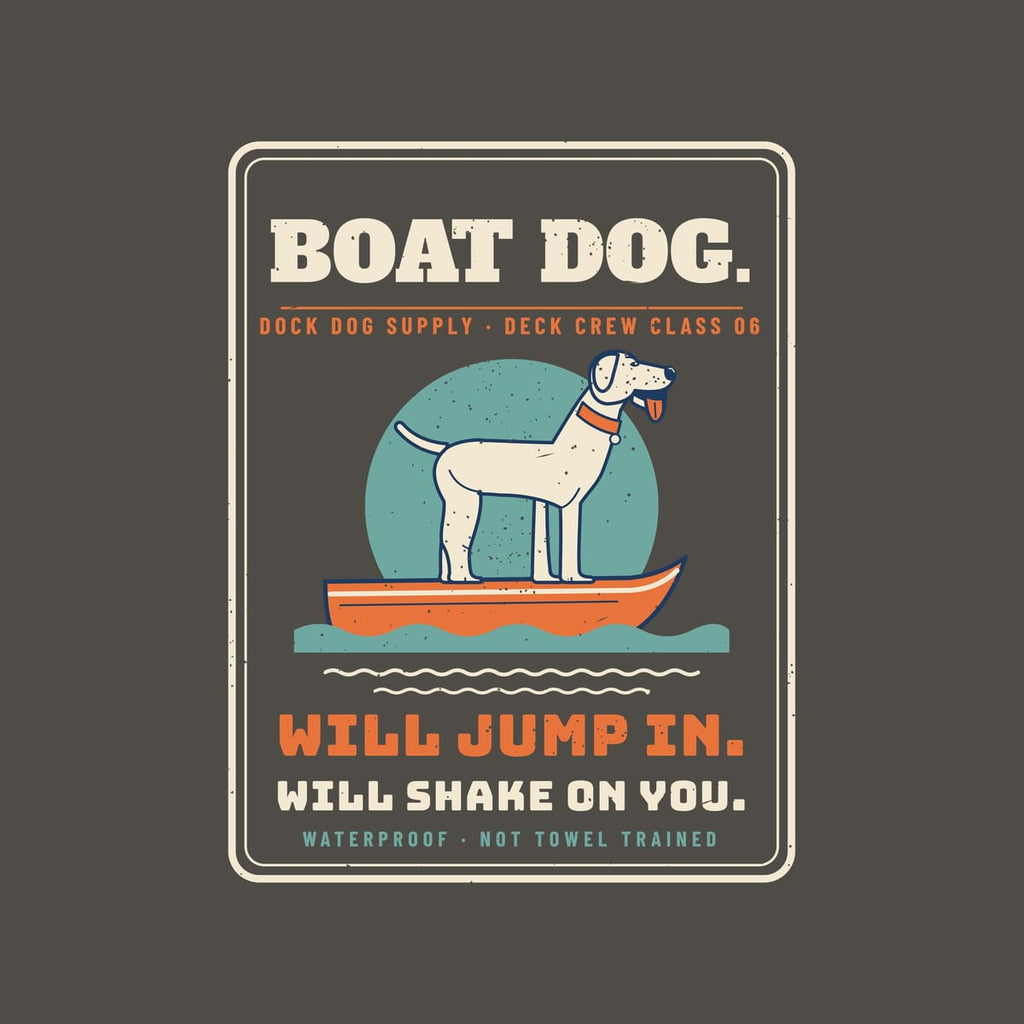 Close-up of the badge showing the standing lab, skiff, teal sun, bold lettering and distressed print texture