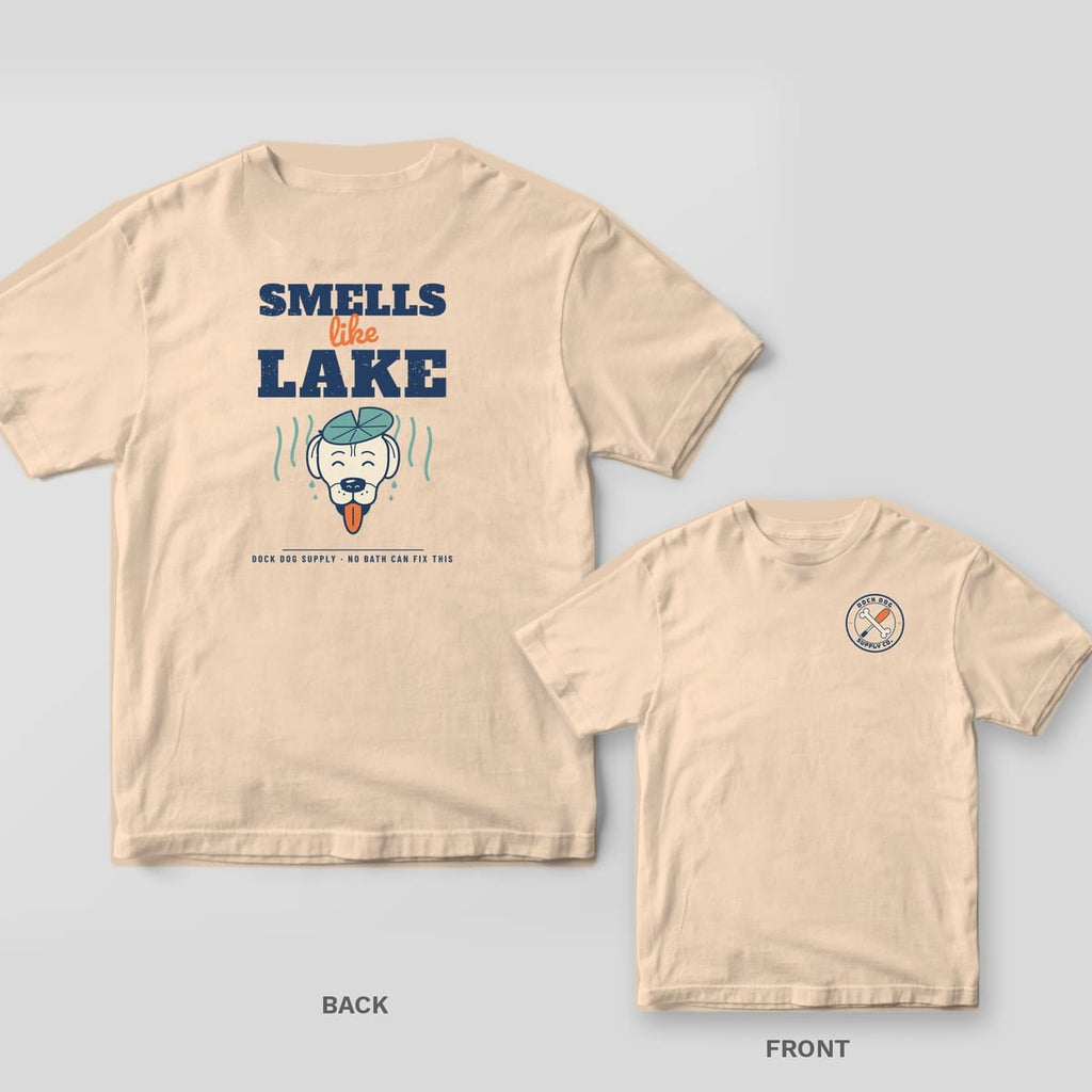 Ivory tee with Smells Like Lake stacked type and a grinning wet lab wearing a lily pad on the back, bone and oar crest on the front