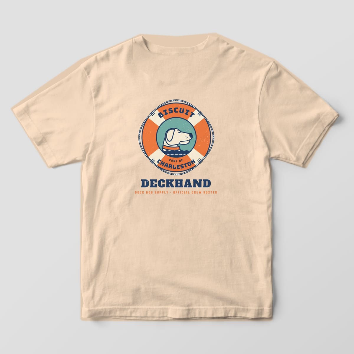 Back of an ivory Comfort Colors tee with an orange life ring reading Biscuit and Port of Charleston around a lab portrait