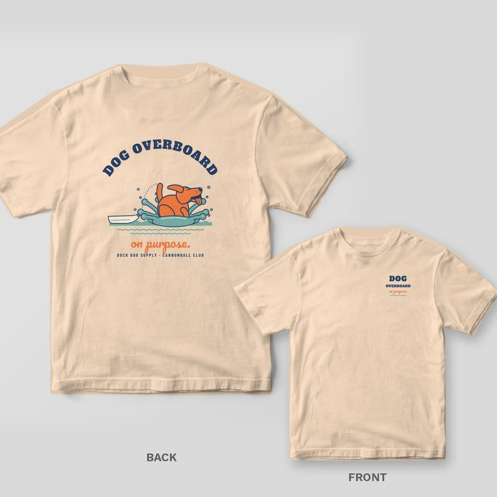 Ivory tee with a cannonballing dog splashing beside a skiff under Dog Overboard on the back, chest text on the front