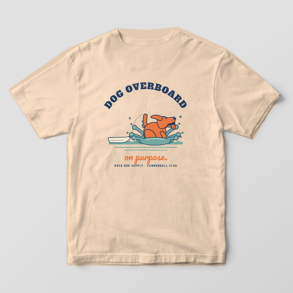 Back of an ivory Comfort Colors tee with an orange lab cannonballing into a teal splash and Dog Overboard arched above