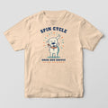 Ivory tee with a full-front print of a lab shaking off water with droplets flying, Spin Cycle above and Dock Dog Supply below