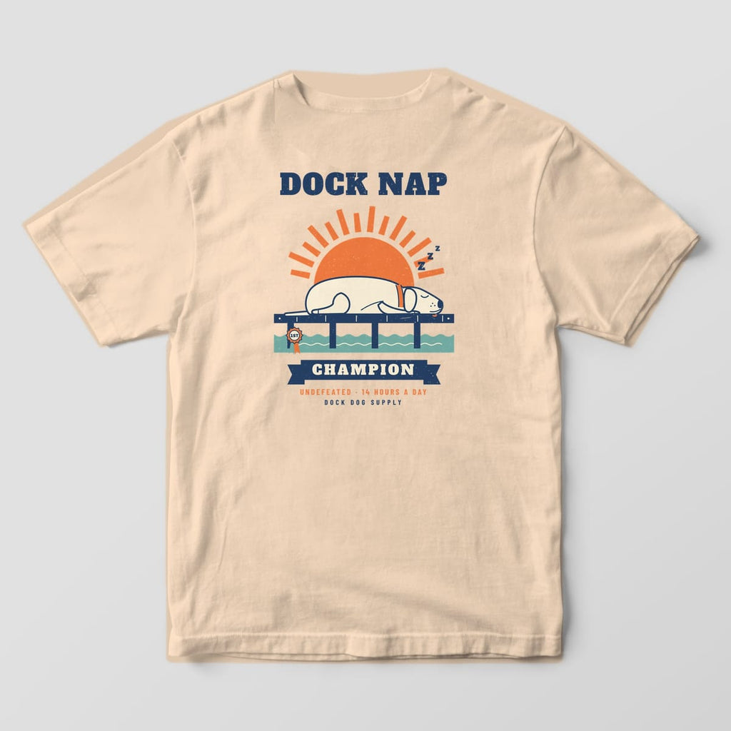 Back of an ivory Comfort Colors tee with a sleeping cream lab on a navy dock under an orange sun, Dock Nap Champion