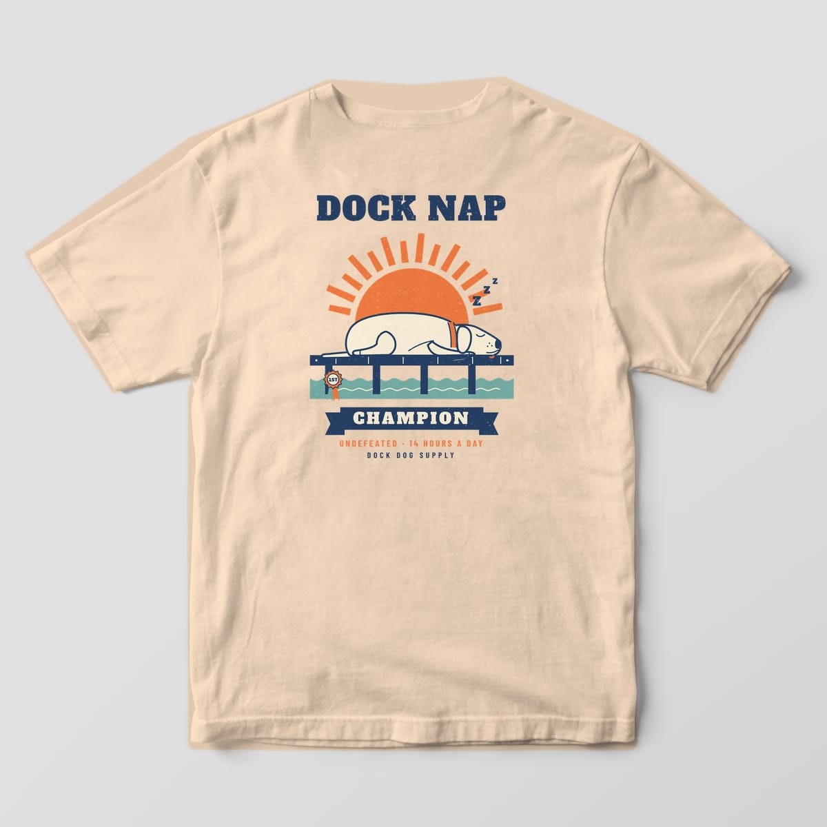 Back of an ivory Comfort Colors tee with a sleeping cream lab on a navy dock under an orange sun, Dock Nap Champion