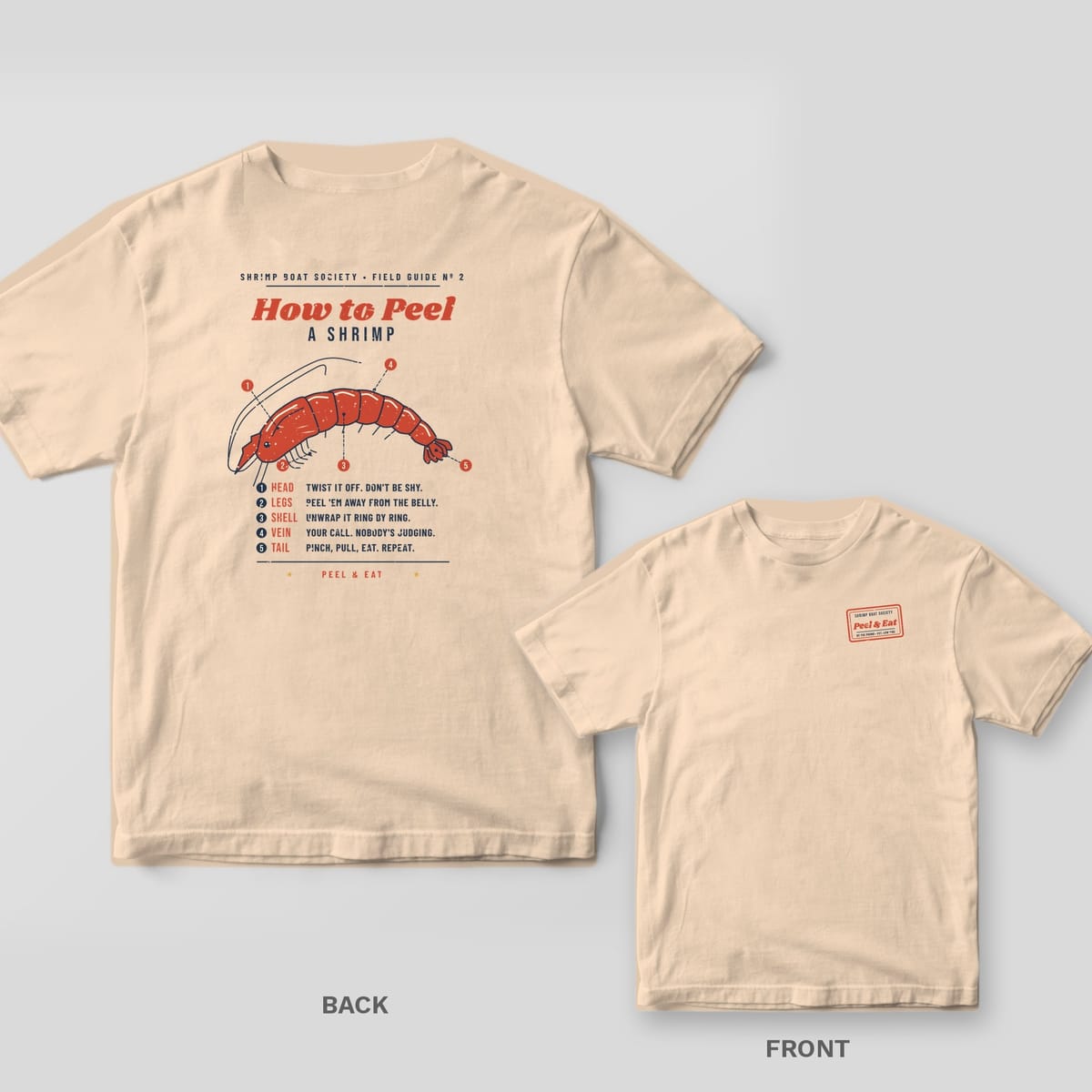 Ivory Comfort Colors tee shown back and front: a How to Peel a Shrimp anatomy chart on the back and a small red Peel and Eat stamp on the left chest.