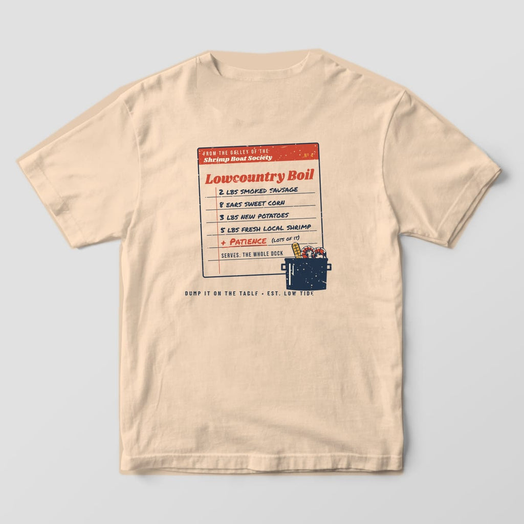 Back of an Ivory Comfort Colors 1717 tee with a handwritten Lowcountry Boil recipe card listing sausage, corn, potatoes, shrimp and patience, with a pot in the corner.