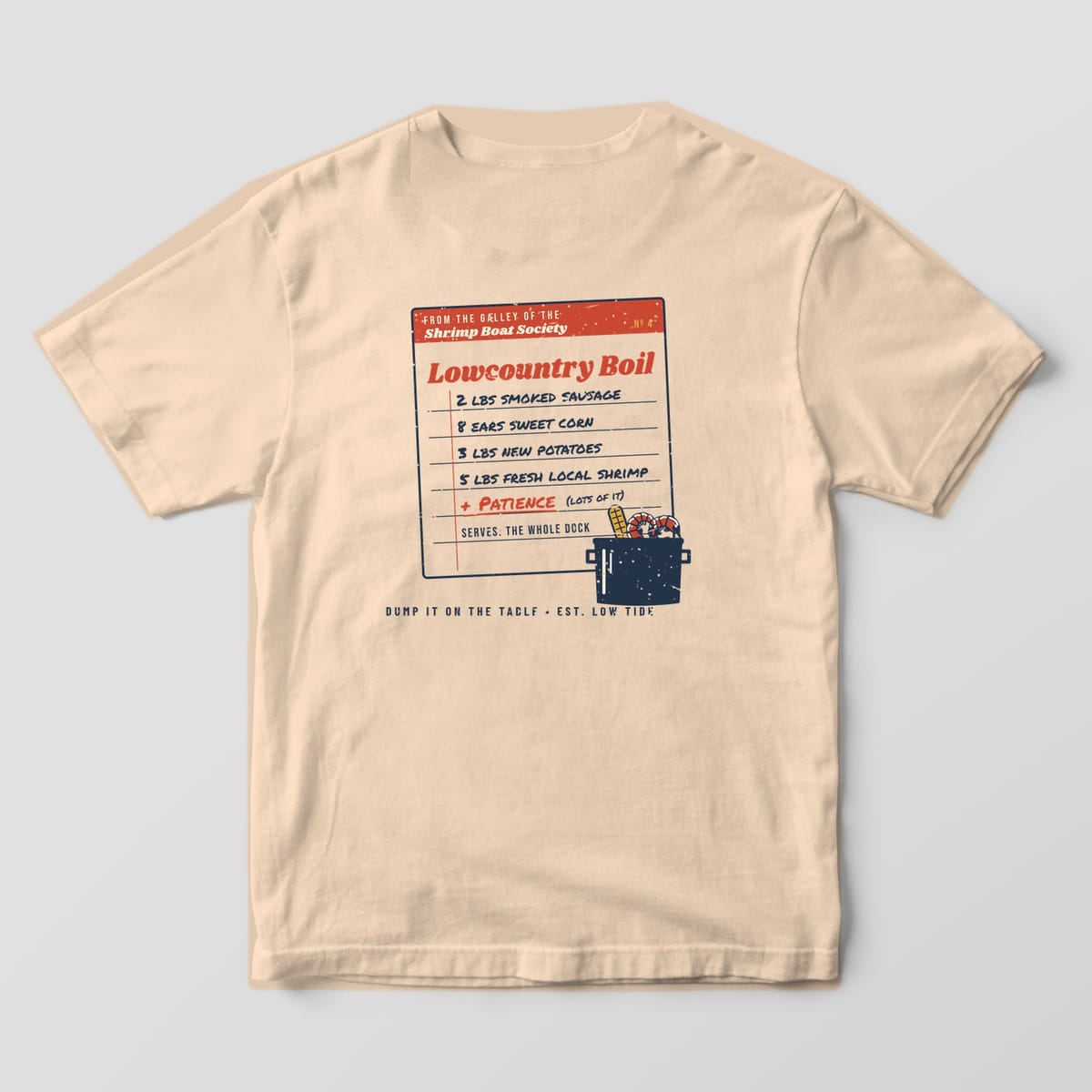 Back of an Ivory Comfort Colors 1717 tee with a handwritten Lowcountry Boil recipe card listing sausage, corn, potatoes, shrimp and patience, with a pot in the corner.