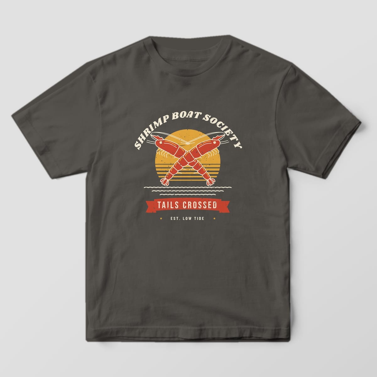 Pepper Comfort Colors tee with a full-front print of two crossed red shrimp over a gold sunrise under the arched words Shrimp Boat Society.